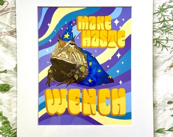 May include: A purple and blue psychedelic background with yellow stars and wavy lines. A frog wearing a blue and gold wizard hat and robe is in the center of the image. The text "Make haste wench" is in yellow letters.