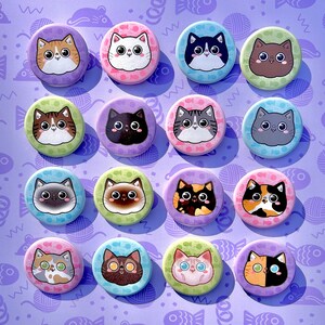 May include: Set of 15 colorful round cat buttons with different cat designs. Each button features a cartoon cat with various colors, patterns, and expressions. The buttons are perfect for adding a touch of whimsy to bags, jackets, or crafts.