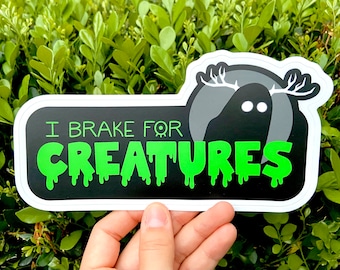 I Brake for Creatures Bumper Sticker | Cryptid Car Decal | Original Fade Weather Resistant Vinyl Sticker | spooky mothman night beast woods