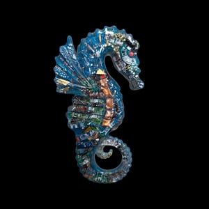 May include: A unique seahorse sculpture crafted from recycled circuit boards, showcasing a blend of blue, green, and metallic components. The artwork is set against a black background, highlighting the intricate details of the repurposed materials.