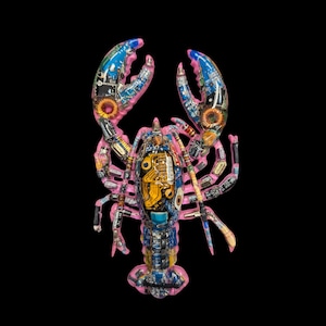 May include: A lobster sculpture constructed from electronic components and circuit boards. The body features a vibrant pink base color accented with blue, yellow, and metallic silver hardware, including resistors, capacitors, and copper coils.