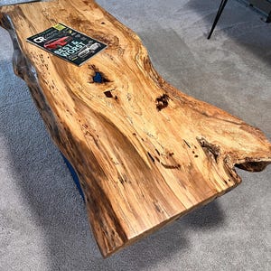 May include: A set of three ceramic mugs with a speckled, matte finish. The mugs are in shades of cream, light gray, and dark gray. Each mug has a simple, minimalist design, perfect for coffee or tea.