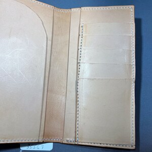 Interior Medium brown roper style vertical wallet all 100 percent USA Herman Oak Leather.