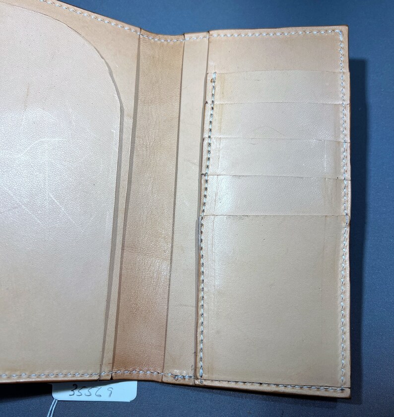 Interior Medium brown roper style vertical wallet all 100 percent USA Herman Oak Leather.