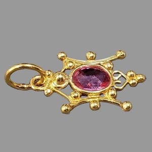 unique gold pendant with pink gemstone designer style