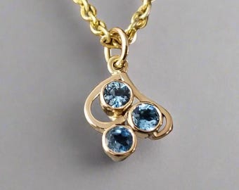 Handmade 14k Gold Swiss Blue Topaz Pendant: Minimalist Round Gemstone