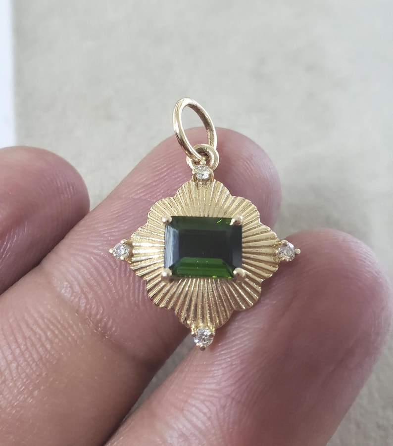 emerald cut deep green tourmaline gold pendant fine jewelry close up