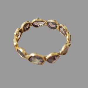 Natural brown diamond eternity band with gold finish