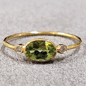 18k Gold Oval Peridot Ring with Diamond Accents