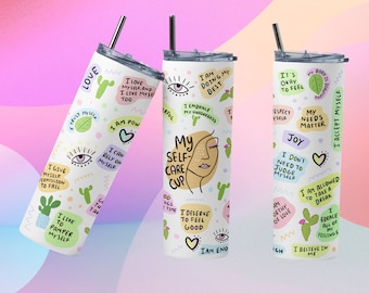 May include: Three stainless steel tumblers with colorful designs and positive affirmations. The tumblers feature phrases like "My Self Care Cup", "I Love Myself", and "I Accept Myself".