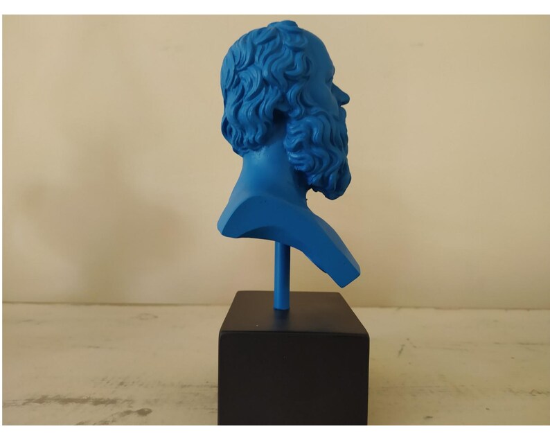 May include: A blue bust sculpture of a man with a beard, on a black base.