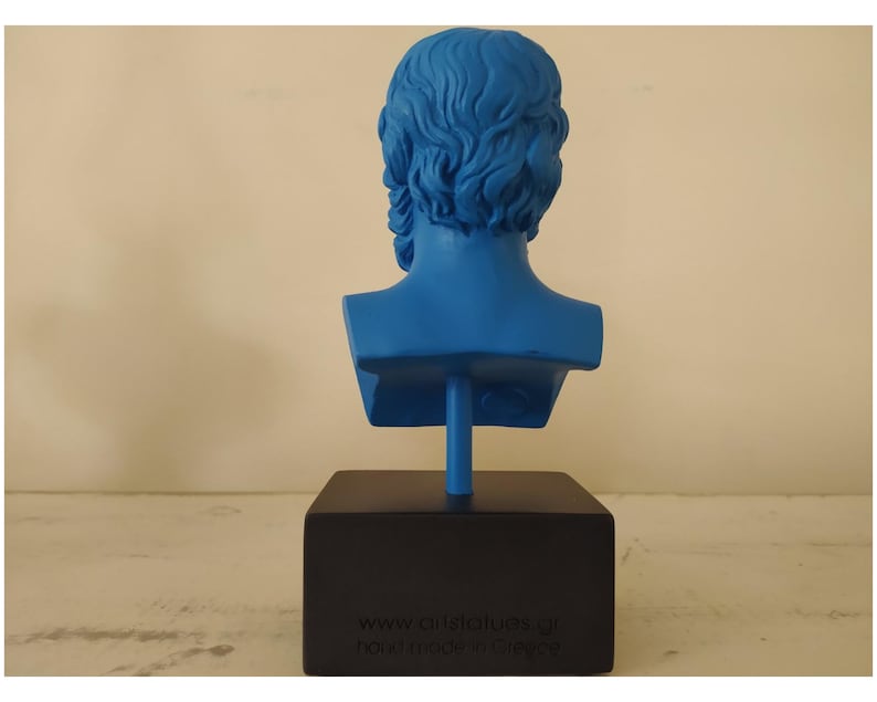 May include: A blue bust sculpture of a man's head and shoulders. The sculpture is on a black base with the text "www.artstatues.gr handmade in Greece".