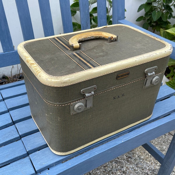 Vintage Art Deco Oshkosh train case with raw hide handle and leather trim