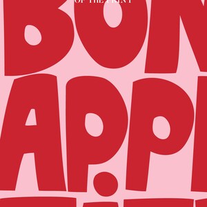 Detailed view of the "Bon Appétit" text in vibrant red chunky lettering on pastel pink, emphasizing the smooth matte finish and high-contrast color palette designed to energize contemporary kitchens or dining rooms.