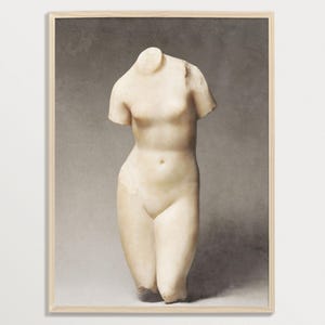 May include: A white marble sculpture of a female torso, with a smooth, polished surface. The sculpture is displayed against a neutral gray background.