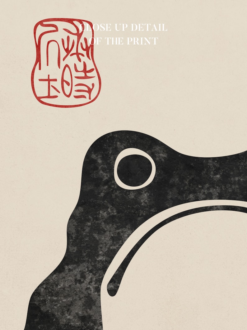 Close-up detail of a Japanese ink-style frog illustration by Matsumoto Hoji, showing the textured black linework and a red calligraphic seal. The cream paper background and minimalist brushwork highlight traditional woodblock aesthetics with a modern, wabi-sabi appeal.