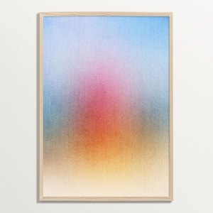 May include: Abstract art print in a wooden frame. The artwork features a gradient of colors, including blue, pink, orange, and yellow. The colors blend together to create a soft, diffused effect. The print is a rectangular shape.