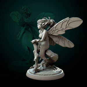 May include: A detailed, grey, sculpted figurine of a fairy with wings, sitting on a tree branch. The fairy has long hair, pointed ears, and is wearing a flowing dress.
