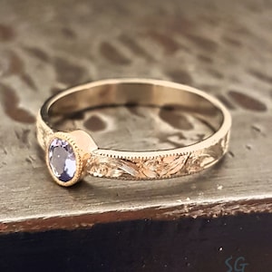 Tanzanite ring. Solid 14 karat two tone white gold with yellow gold setting image 1