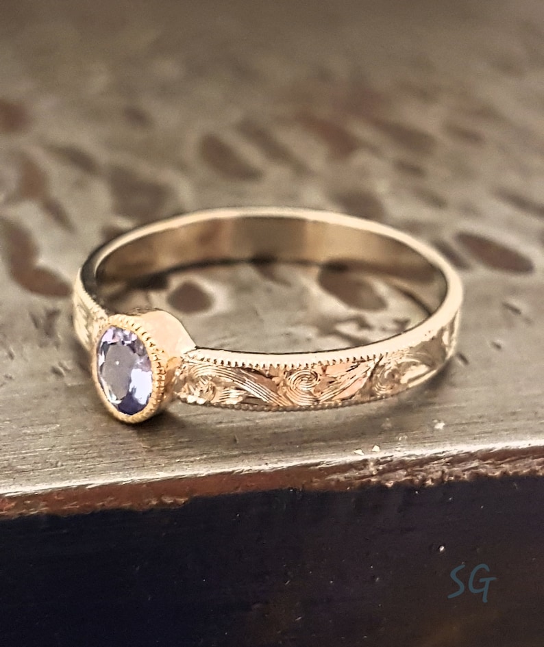 Tanzanite ring. Solid 14 karat two tone white gold with yellow gold setting image 1