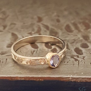 Tanzanite ring. Solid 14 karat two tone white gold with yellow gold setting image 2