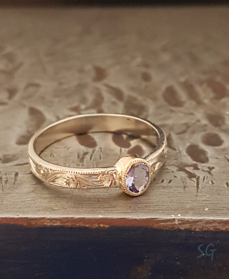 Tanzanite ring. Solid 14 karat two tone white gold with yellow gold setting image 2