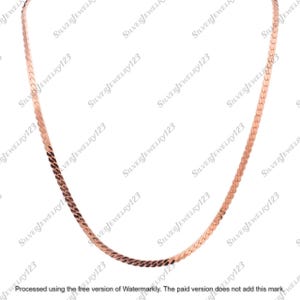 May include: A rose gold herringbone chain necklace. The necklace is made of small, flat, interlocking links that create a smooth, flexible chain. The chain is displayed against a white background.