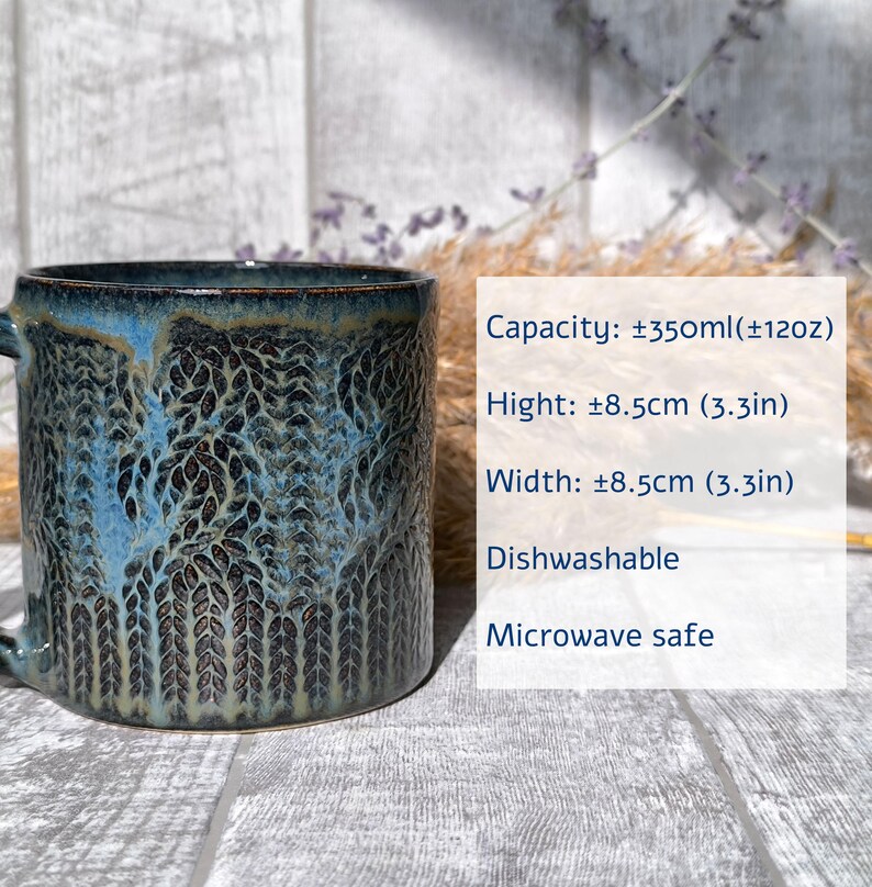 May include: A blue ceramic mug with a leaf pattern. It holds approximately 12 ounces and is dishwasher and microwave safe. Capacity: &plusmn;350ml(&plusmn;12oz) Hight: &plusmn;8.5cm (3.3in) Width: &plusmn;8.5cm (3.3in) Dishwashable Microwave safe