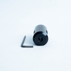 May include: A black metal coupler with an Allen key for tightening. The coupler has a hole in the centre and two sets of holes on the sides.