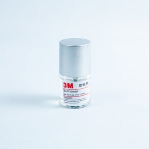 May include: A small silver bottle of 3M 94 Primer, with a red label that says "3M 94 Primer" and "Net 32 fl oz (1 qt) 1 L (1104 ml)". The label also has a red "DANGER!" warning.