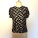 see more listings in the Tops / Blouses section