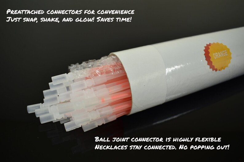 May include: A bundle of orange glow sticks with preattached translucent plastic connectors housed in a white cylindrical tube. The tube features an orange sticker with the text ORANGE. Text on the image reads PREATTACHED CONNECTORS FOR CONVENIENCE JUST SNAP, SHAKE, AND GLOW! SAVES TIME! and BALL JOINT CONNECTOR IS HIGHLY FLEXIBLE NECKLACES STAY CONNECTED. NO POPPING OUT!