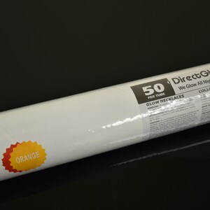 May include: A cylindrical tube containing 50 orange glow necklaces, measuring 22 inches each. The white label features the text DirectGlow LLC, We Glow All Night Long, 50 PER TUBE, GLOW NECKLACES, and a starburst graphic labeled ORANGE.