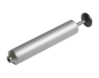 May include: A silver-colored, cylindrical tool with a small nozzle on one end and a circular, black disc on the other. The tool has a long, straight body and a thin rod connecting the body to the disc.
