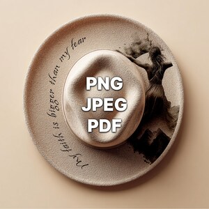 May include: A beige fedora hat with a wide brim. The brim features the text "My faith is bigger than my fear" in black script. The hat has a graphic of a woman on the right side and the words "PNG JPEG PDF" in the center.