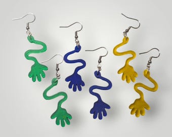 May include: A collection of six colorful dangle earrings. Each earring features a wavy, elongated design with a hand-shaped charm at the bottom. The earrings are in green, blue, and yellow, with silver-tone ear wires.