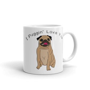 May include: White ceramic mug with a black outline. The mug features a cartoon pug with a pink tongue and the text "I Puggin' Love You".