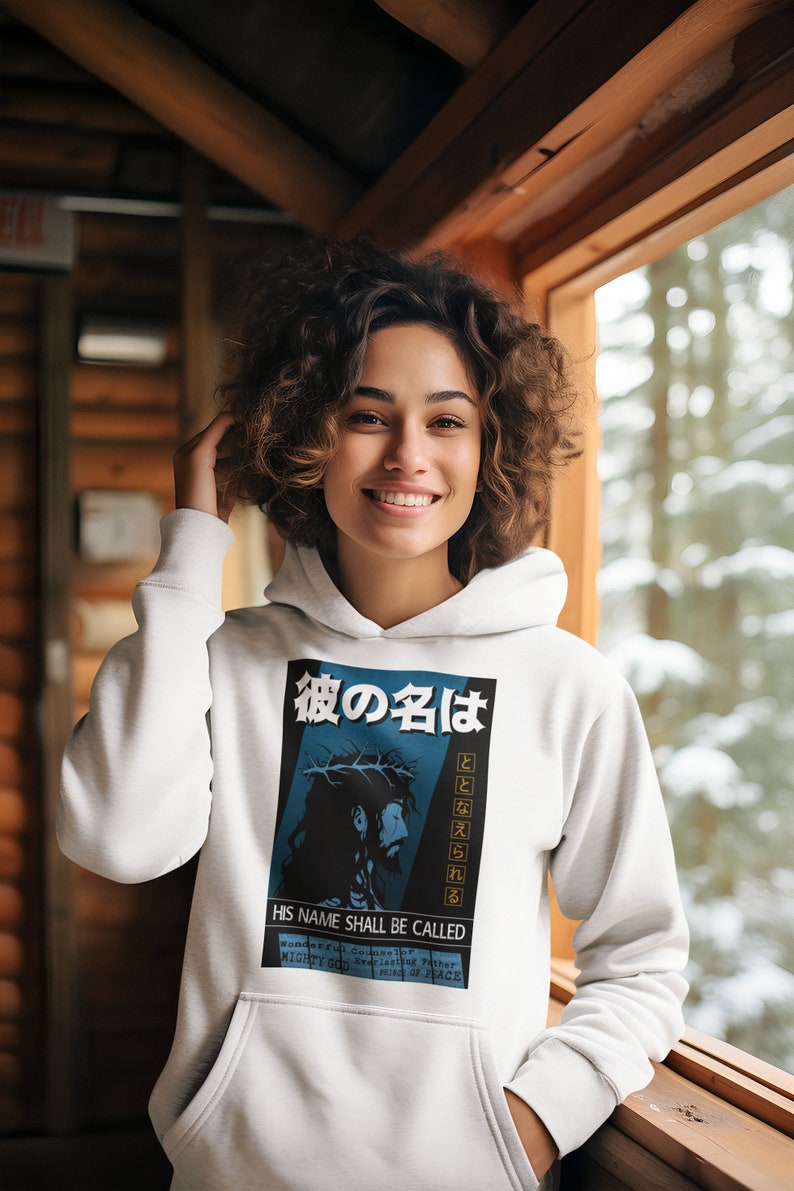 May include: White hoodie with a graphic print of a man with a crown of thorns. The graphic includes the text "His Name Shall Be Called" and Japanese text.