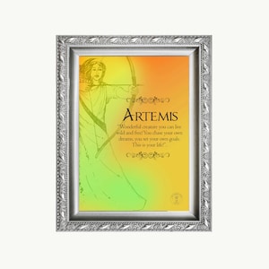 May include: A framed print with a yellow and green gradient background. The print features a line drawing of a woman with a bow and arrow. The text "ARTEMIS" is at the top of the print, and the text "Wonderful creature you can live wild and free! You chase your own dreams, you set your own goals. This is your life!" is below the drawing.