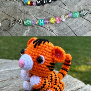 May include: Two keychains with the name "MISTY" spelled out in black letter beads and colorful beads. A crocheted orange tiger with black stripes and white accents sits below the keychains.