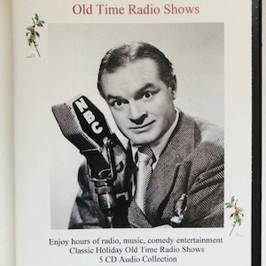 May include: A black and white photo of Bob Hope holding a microphone with the NBC logo. The text on the cover reads "Bob Hope Holiday Radio Theater Collection Old Time Radio Shows" and "Enjoy hours of radio, music, comedy entertainment Classic Holiday Old Time Radio Shows 5 CD Audio Collection".
