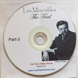 K&ouml;nnte beinhalten: Eine wei&szlig;e CD mit dem Text "Les Mis&eacute;rables The Trial" und "Part-3". Sie zeigt ein Schwarz-Wei&szlig;-Bild von Orson Welles. Die CD ist mit "Old Time Radio Shows Audio CD" und einer Website-Adresse beschriftet.