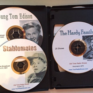 May include: A black CD case containing three audio CDs. The CDs feature images of actors and text including "Young Tom Edison," "Stablemates," and "The Hardy Family." The CDs are labeled "Old Time Radio Shows."