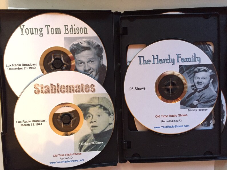 May include: A black CD case containing three audio CDs. The CDs feature images of actors and text including "Young Tom Edison," "Stablemates," and "The Hardy Family." The CDs are labeled "Old Time Radio Shows."