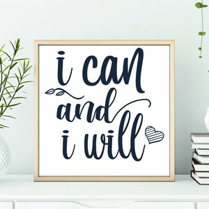 May include: A framed print with a white background and black text that reads "i can and i will" with a small striped heart to the right of the text.