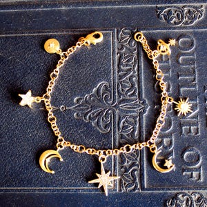Vintage bedelarmband met delicate messing planeet, maan en ster