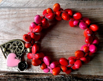 Bracelet extensible papillon en pierre rouge orange et rose avec pendentif coeurs et fleurs