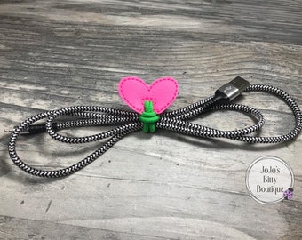 Heart shaped cord keeper