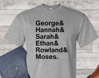 May include: A heather grey t-shirt with black text that reads "George & Hannah & Sarah & Ethan & Rowland & Moses."