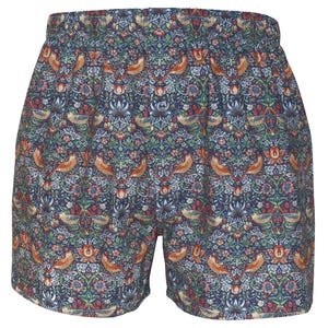 May include: Boxer shorts featuring a detailed floral and bird design in blue, green, red, and orange. These shorts have an elasticated waistband and a relaxed fit, suitable for comfort and leisure.